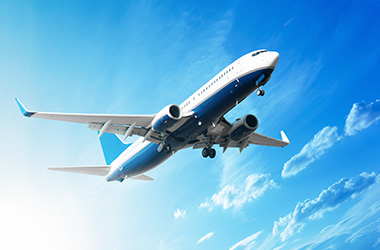 View from below of a plane flying through the sky