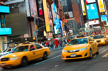 Taxi's driving through big city