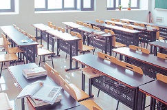 Classroom with desks and chairs in rows