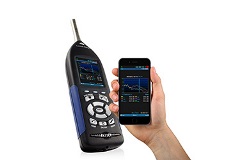 SoundAdvisor 831C next to hand holding SmartPhone